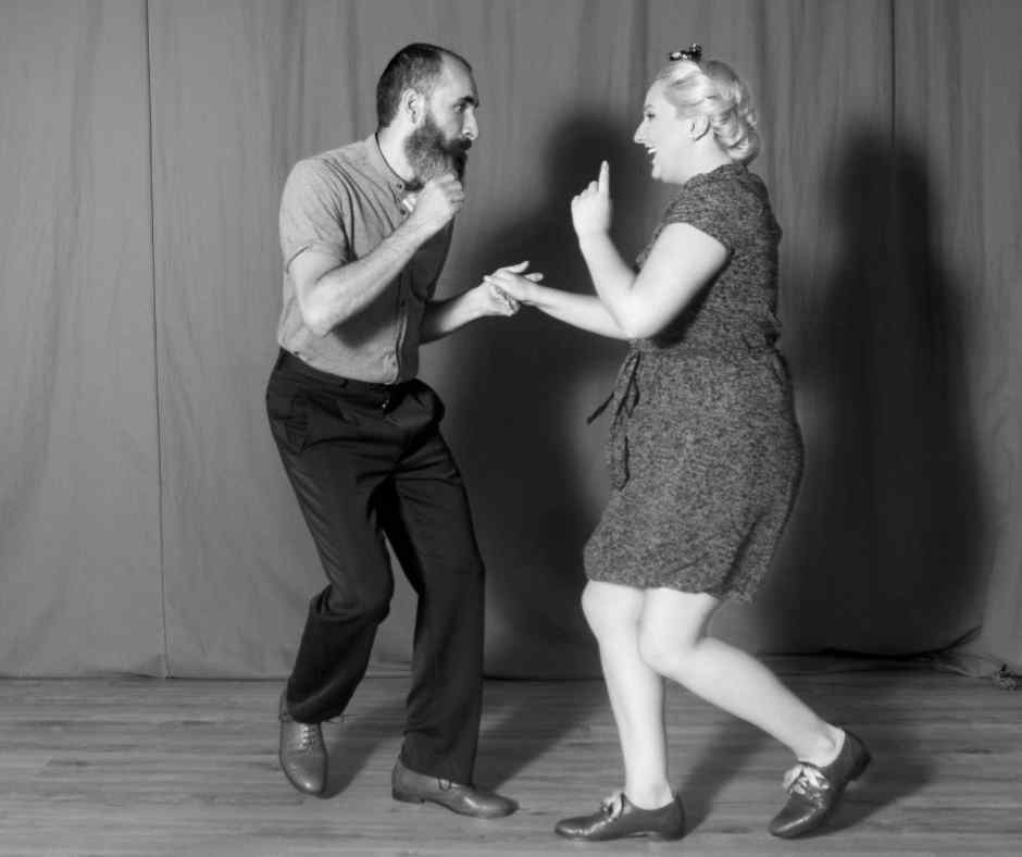 A man and woman dance the East Coast Swing Dance 